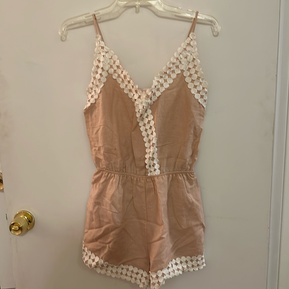 Pastel pink romper. Size small. In good condition.